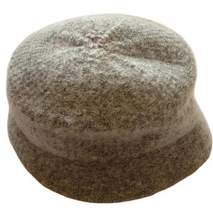 May include: A gray, textured bucket hat. The hat has a rounded crown and a slightly curved brim. The hat appears to be made of a soft, wool-like material. The hat is a neutral color, suitable for various outfits.