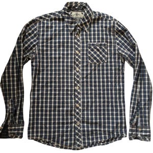 May include: A long-sleeved button-down shirt with a blue, white, and black checkered pattern. The shirt has a chest pocket and a button-down collar. The cuffs have buttons. The shirt is made of a lightweight fabric.