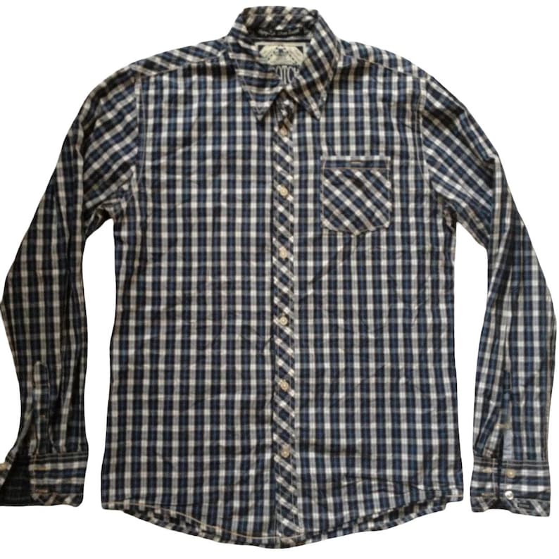 May include: A long-sleeved button-down shirt with a blue, white, and black checkered pattern. The shirt has a chest pocket and a button-down collar. The cuffs have buttons. The shirt is made of a lightweight fabric.