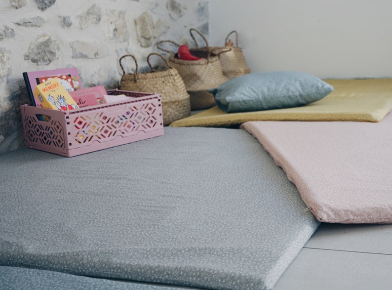 baby mattress on floor