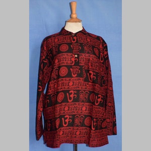 May include: A black long-sleeved shirt with a red and black print of the Om symbol and other Sanskrit characters.