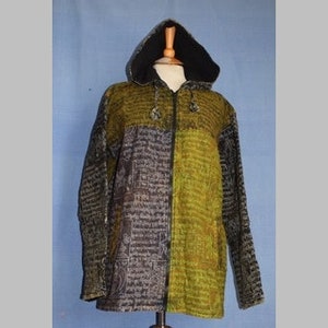 May include: A hooded jacket with a full-length zipper, displayed on a mannequin. The jacket features a split design: one side is olive green, the other is dark gray with a textured pattern. The hood is lined with black fabric. The jacket is made of a textured fabric.