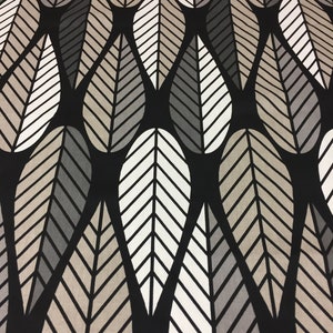 May include: Black fabric with a repeating pattern of white and gray stylized leaves. The leaves are arranged in a staggered pattern, creating a sense of movement and depth.