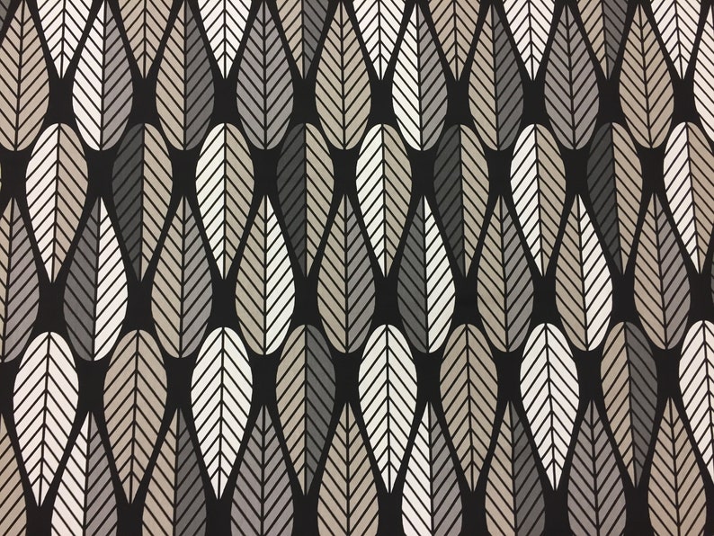 May include: A black fabric with a repeating pattern of stylized leaves in shades of gray, white, and brown.