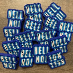 May include: A pile of blue and white 'Hell No!' charms. The charms are made of a soft, rubbery material and have a raised, 3D design.