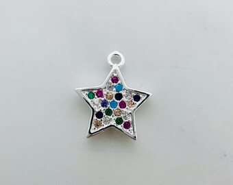 May include: A silver star charm with a variety of colorful gemstones, including blue, green, pink, and white.