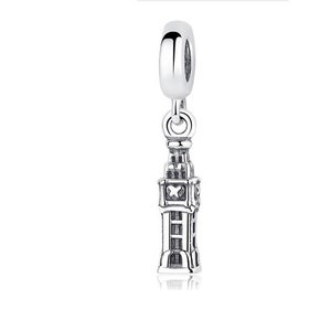 May include: Silver charm in the shape of Big Ben, a famous landmark in London, England. The charm has a loop at the top for attaching to a bracelet or necklace.
