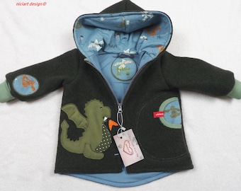 May include: A dark green hooded jacket with a dragon applique on the front. The jacket has a blue lining with a pattern, a zipper closure, and patches on the sleeves. The cuffs are light green.