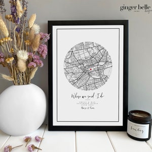 May include: Black and white map print with a red heart marking the location of a wedding. The print is framed in a black frame and has the text "Where we said I do."  Emily & Dan,  [Date]  Always & Forever.