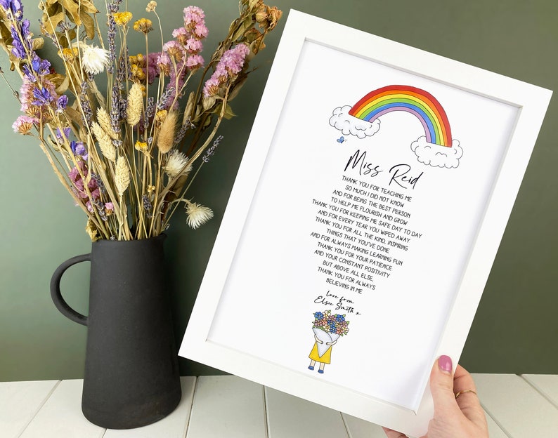 May include: A framed print with a rainbow and clouds, a handwritten message thanking a teacher named Miss Reid, and a small illustration of a person holding flowers. The text reads: "Thank you for teaching me so much I do not know and for being the best person to help me flourish and grow. Thank you for keeping me safe day to day and for every tear you wiped away. Thank you for all the kind, inspiring things that you've done, and for always making learning fun. Thank you for your patience and your constant positivity but above all else, thank you for always believing in me. Love from, Elsie Smith."