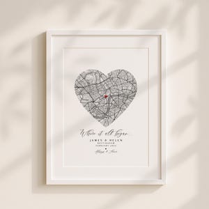May include: White framed print with a heart-shaped map design. The map has a red marker and the text "Where it all began...". Below the map are names, a date, and the phrase "Always & Forever". The print is a romantic keepsake.