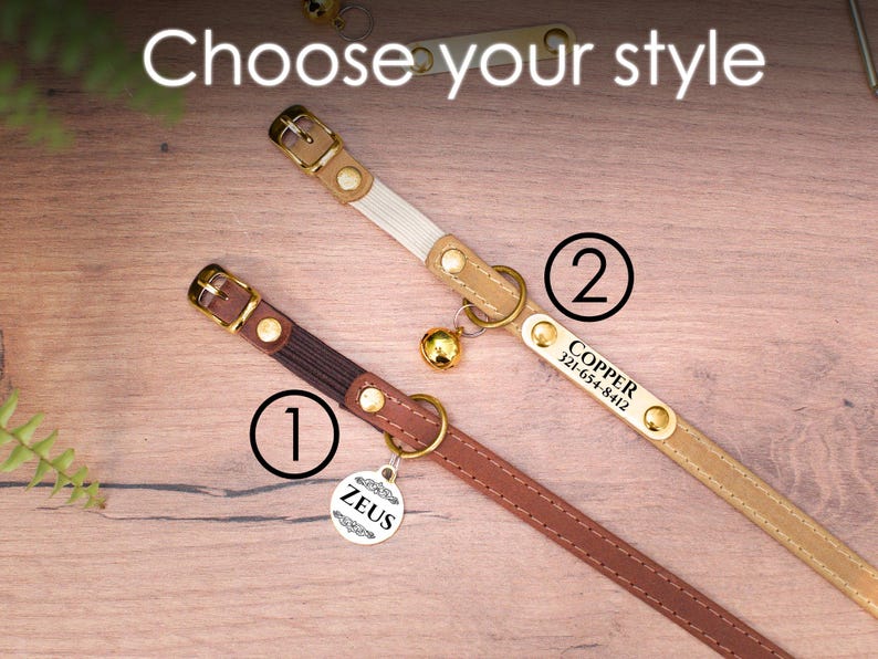 May include: Two cat collars with personalized tags. The first collar is brown leather with a gold tag that says "ZEUS". The second collar is beige with a gold tag that says "COPPER 321-654-8412".