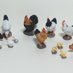 May include: A collection of miniature farm animal figurines, including chickens and chicks. The chickens have black, white, and brown feathers with red combs. The chicks are yellow. The figurines are on small, dark bases.