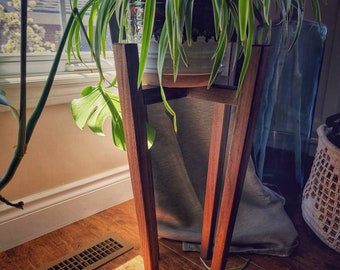 Stylish mid century modern style plant stand with tapered legs and traditional joinery