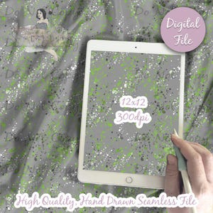 May include: A digital seamless pattern with a gray background and green, white, and silver paint splatters. The pattern is 12 inches by 12 inches and 300 dpi.