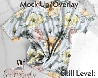 May include: A mock-up of a white t-shirt with a floral pattern featuring yellow and pink roses on a light blue background. The text "Easy to edit Mock Up/Overlay" is at the top of the image. The text "Some Finn Graphics" is at the bottom of the image. The text "Skill Level: Beginner" is at the bottom right of the image.