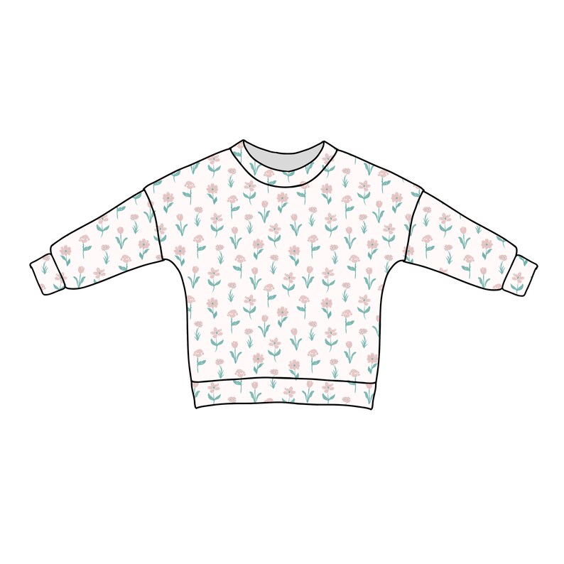 Pode incluir: Uma camisa de manga comprida branca com estampa floral com flores rosa e verdes.