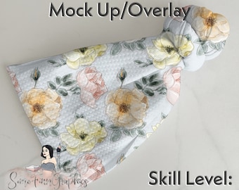 May include: A white fabric mockup with a floral pattern of yellow, pink, and green roses. The fabric is bunched up in the upper right corner. The text "Easy to edit Mock Up/Overlay" is at the top of the image. The text "Some Finn Graphics" is at the bottom left of the image. The text "Skill Level: Beginner" is at the bottom right of the image.