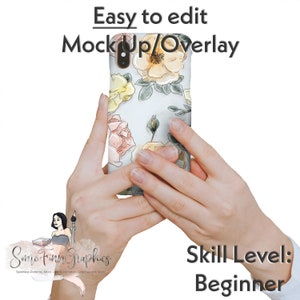 May include: A mockup of a phone case with a floral design. The case features a white background with pink, yellow, and green watercolor flowers. The phone case is being held by a person's hands.