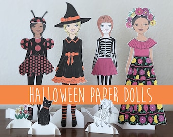 May include: Four paper dolls dressed in Halloween costumes. The dolls are a ladybug, a witch, a skeleton, and a Day of the Dead inspired doll. The dolls are standing on a table with a banner that reads "Halloween Paper Dolls".