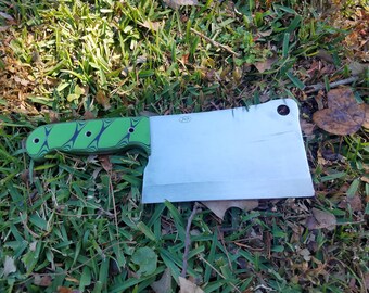 Light Cleaver Made With D2 Steel With A Green and Black G10 Handle And A Kydex Cover.