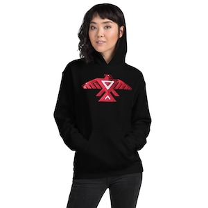 May include: Black hooded sweatshirt with a red sequined Native American eagle design on the front.