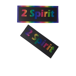 May include: Two black rectangular stickers with a rainbow colored text that reads "2 Spirit" on each.