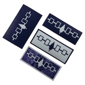 May include: Four different versions of a white stylized Native American symbol on a blue background. The symbol is a stylized tree with a line of squares on either side.