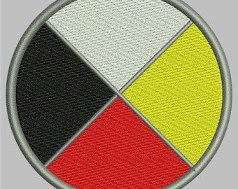 May include: A circular patch with a gray border and four colored sections. The sections are black, white, yellow, and red. The colors are arranged in a clockwise pattern.