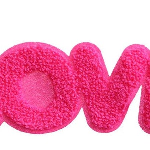 May include: Pink fluffy letters spelling out the word "LOVE".