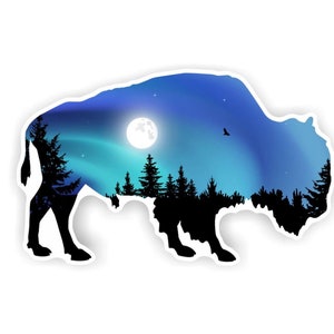 May include: Silhouette of a bison with a night sky and aurora borealis inside. The sky is blue and purple with a full moon and stars.