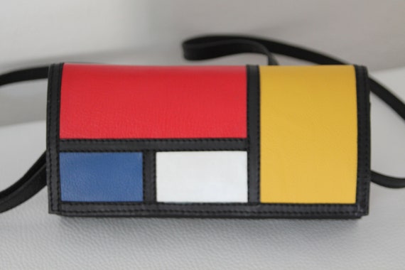 black and yellow clutch bag