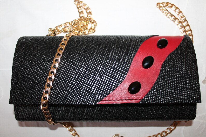red and black clutch