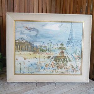 May include: A framed painting of a cityscape with the Eiffel Tower in the background. The painting is done in a loose, impressionistic style with a blue and white color scheme. The painting is signed "June 1979" in the lower left corner.