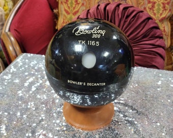 Vintage mid century modern atomic bowling decanter.