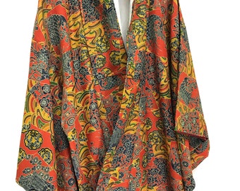 May include: A red and yellow kimono with a floral and wave pattern. The kimono is made of a lightweight fabric and has a relaxed fit.