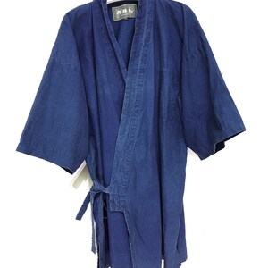 May include: A dark blue cotton robe with a tie belt. The robe has a label that says "AKAGAMI" and a smaller label with Japanese characters.