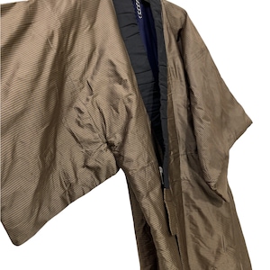 May include: A brown and black striped kimono with a black collar and a navy blue lining.