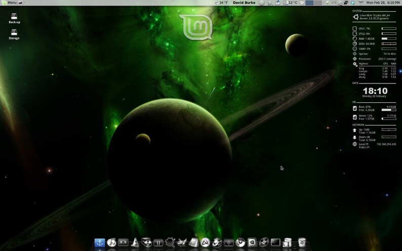 May include: A computer desktop background featuring a green and black space scene with planets, rings, and nebulae. The Linux Mint logo is in the upper center. System information is displayed on the right side.