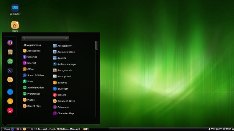 May include: A computer desktop interface with a green background and a black application menu. The menu includes options like "All Applications," "Graphics," and "Wine." Icons are colorful, and the time is displayed in the bottom right corner.