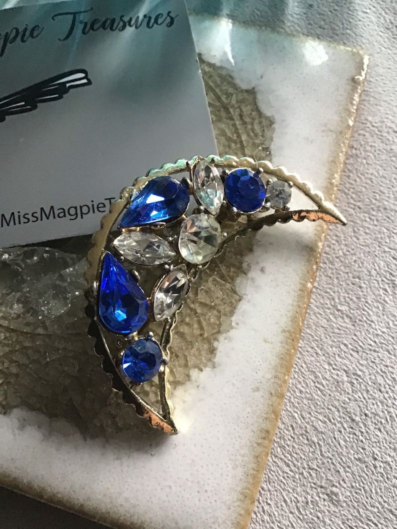 1950\u2019s vintage Crescent moon brooch with Sapphire glass crystal detail