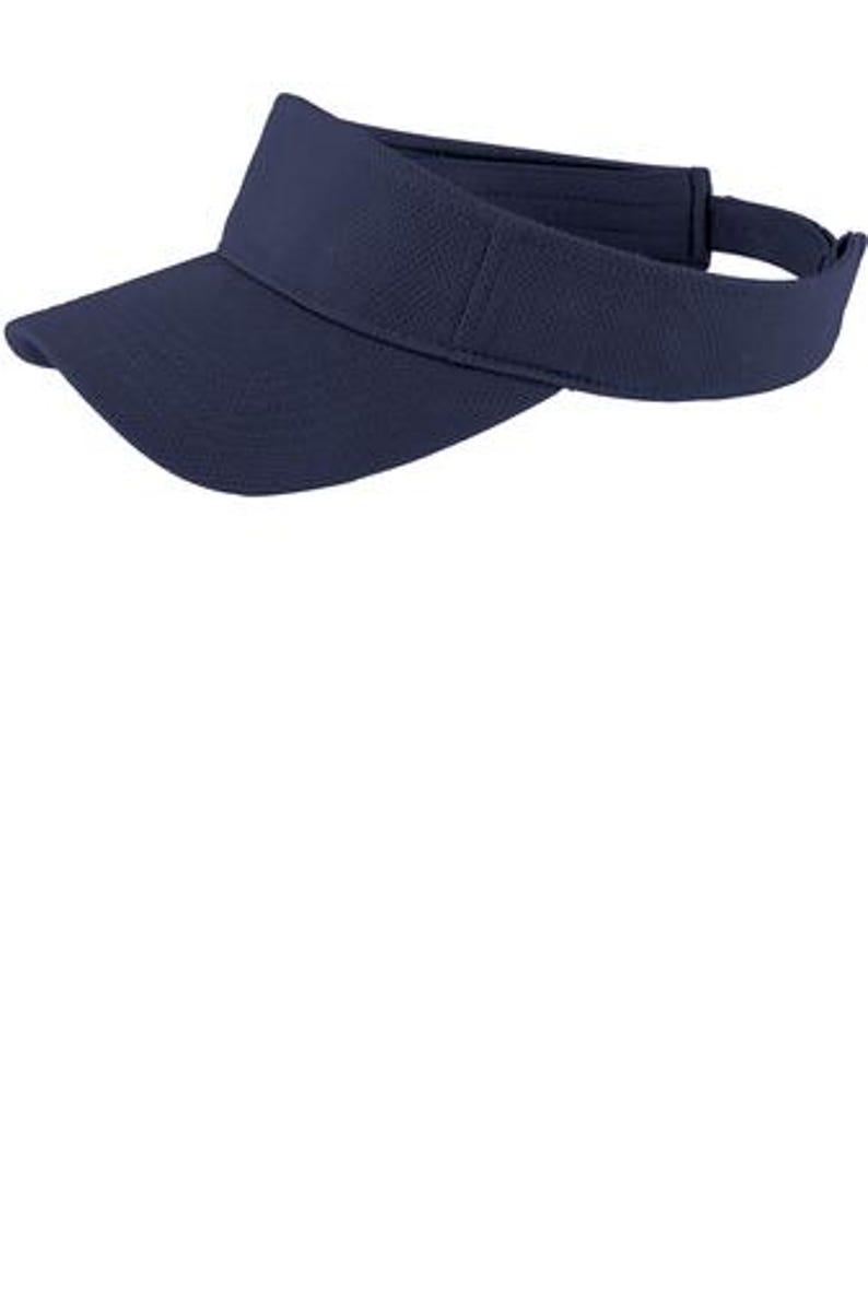 May include: A solid navy blue visor with a curved brim and a textured fabric finish. The headwear features an adjustable strap at the back to secure the fit, providing a simple and functional design for sun protection during outdoor activities.