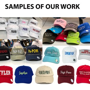 May include: A collection of baseball caps and visors in various colours including white, black, blue, red, green, and tan. The headwear features embroidered text such as Gaga, Mom, Papadoo, Team Sach, Samantha, Coach Phive, and Make Crawfish $1.97/LB Again.