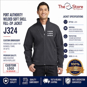 May include: A dark gray Port Authority welded soft shell full-zip jacket, model J324, featuring a chest pocket, zippered front pockets, and a placeholder for a custom logo. The jacket is made of 100% polyester shell and microfleece, with 1000mm waterproof rating.