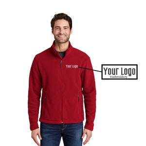 May include: Red fleece jacket with a zipper closure and two front pockets. The jacket has "Your Logo" embroidered on the left chest.