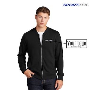 May include: Black zippered bomber jacket with a 'Your Logo' embroidery on the left chest.