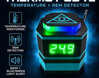 May include: The Thermo Pod V2 is a black and teal electronic device featuring a digital display showing 24.9 in green. It includes a top-mounted antenna, a glowing green and blue light strip, and an eye-in-triangle graphic. Text includes Temperature + Rem Detector and Two Detection Systems • One Device.