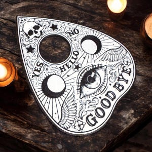 White & black ouija Planchette for paranormal spirit ghost investigations and vigils divination