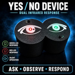 May include: A black Yes/No device with dual infrared response, featuring two circular units with white eye graphics. The left eye has a red LED, and the right eye has a green LED. Text includes "YES/NO DEVICE", "DUAL INFRARED RESPONSE", and "ASK • OBSERVE • RESPOND".