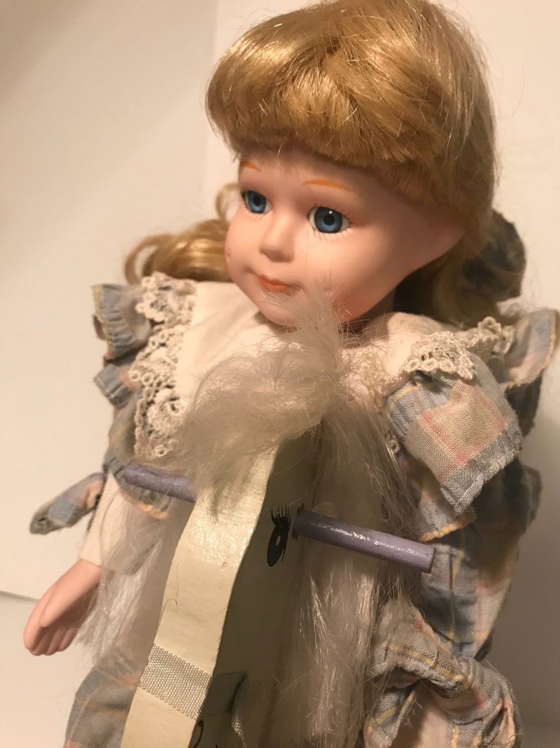 porcelain doll on rocking horse